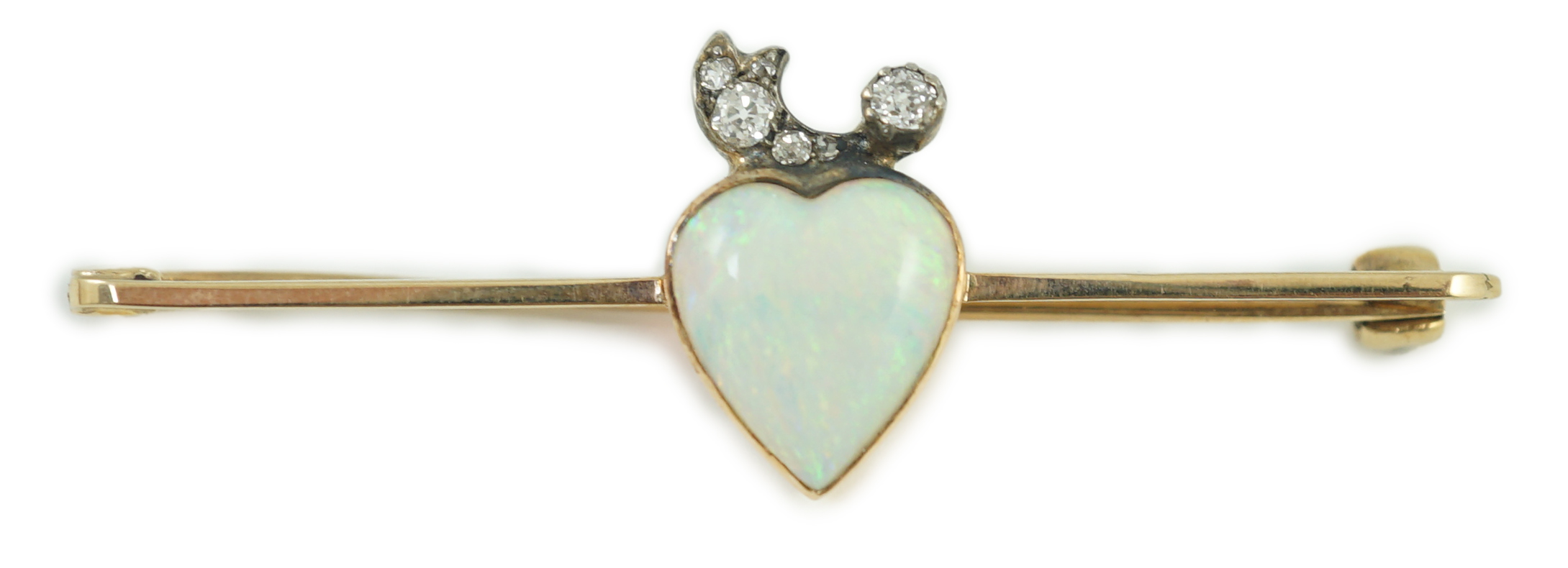 An early 20th century gold, heart shaped white opal and six stone diamond set bar brooch